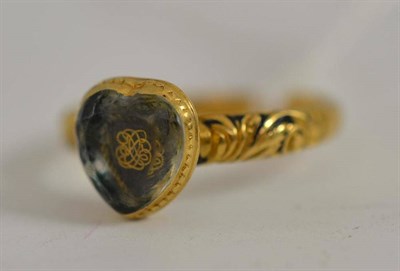 Lot 18 - A mourning ring with entwined initials under a rock crystal heart shaped stone