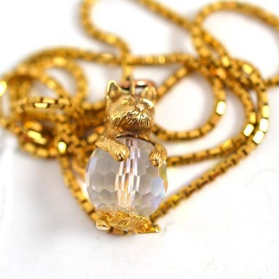 Lot 24 - A 9ct gold chain and a cat charm