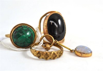 Lot 33 - An opal pendant, a malachite ring, a star ring and another ring