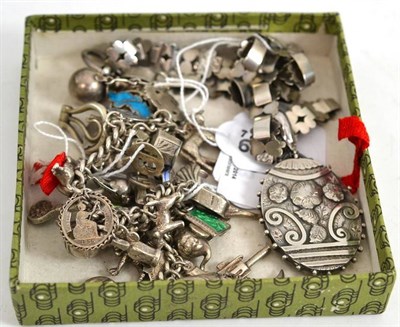 Lot 38 - Silver charm bracelet and locket