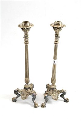 Lot 54 - A pair of silver plated candlesticks in the Rococo style with screw-off sconces and bayonet...