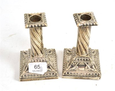 Lot 65 - A pair of Victorian silver candlesticks