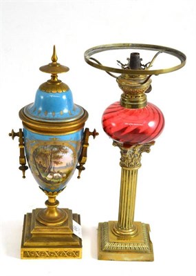 Lot 66 - A Continental porcelain ormolu mounted porcelain vase and cover and an oil lamp with Corinthian...
