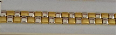 Lot 104 - A two colour bracelet stamped ";750"