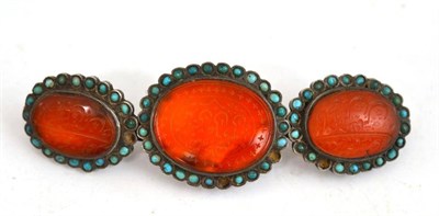 Lot 110 - A 19th century Indo-Persian carved cornelian and turquoise mounted triple belt buckle