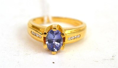 Lot 122 - An 18ct gold sapphire and diamond ring