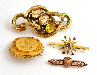 Lot 136 - A 9ct gold bar brooch, another, a circular brooch and a paste set brooch (4)