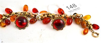 Lot 148 - An amber bracelet with letter (following repair) and a pair of earrings stamped '9CT' CL