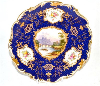 Lot 150 - A Coalport porcelain dessert plate painted with a view of Richmond Castle on a scale blue ground