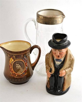 Lot 159 - A cut glass water jug with silver mounts, a Royal Doulton Winston Churchill Toby jug and a...