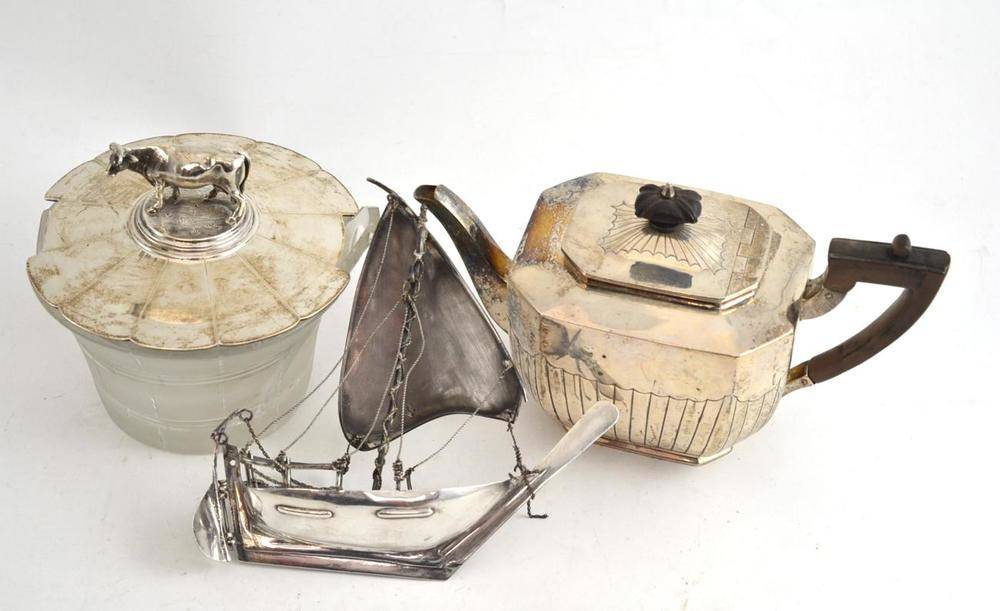 Lot 183 - A silver teapot, a William IV butter dish with cut glass bowl (badly damaged) with a silver...