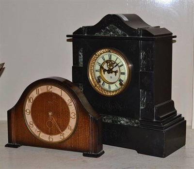 Lot 194 - A black slate striking mantel clock with another timepiece