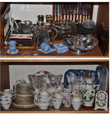 Lot 215 - Two shelves of ceramics, glass and silver plate including two canteens of cutlery, tea service,...