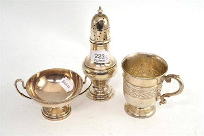 Lot 223 - Three pieces of Edwardian silver, comprising Celtic design mug, large sugar caster and a two...