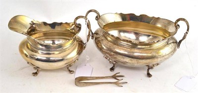 Lot 230 - Silver sugar basin and cream jug with sugar nips