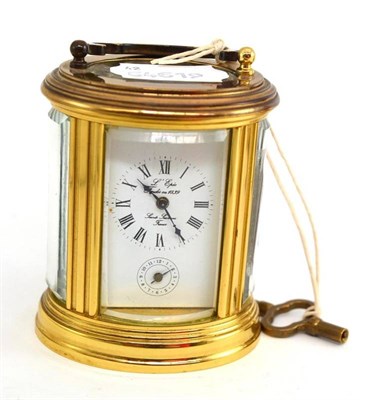 Lot 231 - Small oval L'Epee alarm carriage timepiece with key