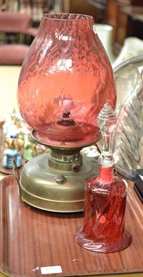 Lot 276 - Brass oil lamp and a cranberry glass bell