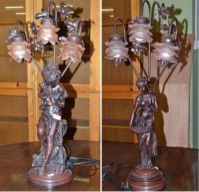 Lot 280 - A pair of figural lamps, each modelled as a maiden with three peach shades