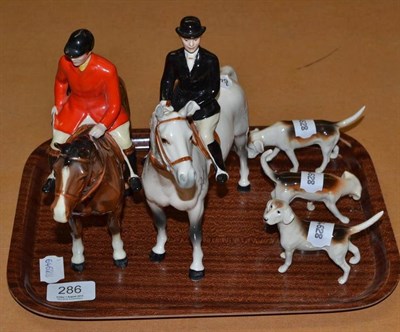 Lot 286 - Two Beswick Hunters and three hounds