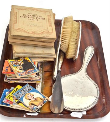 Lot 289 - A silver dressing table set and a collection of cigarette card albums