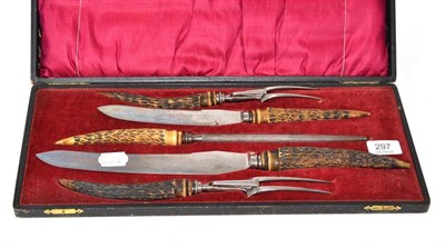 Lot 297 - A carving set in fitted case with horn handles and Dickinson of Sheffield blades