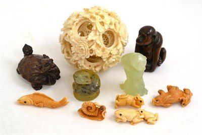 Lot 322 - A Chinese puzzle ball, eight various netsukes, a jade monkey etc