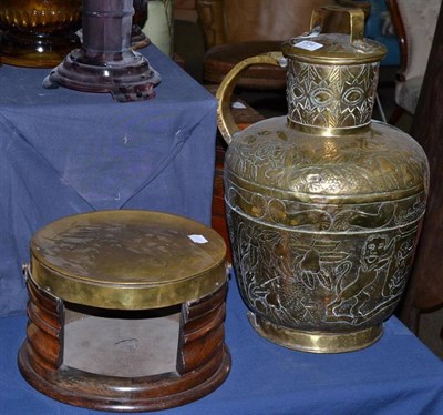 Lot 334 - A brass mounted mahogany foot warmer, a large lidded jug embossed with lions and flowers and...