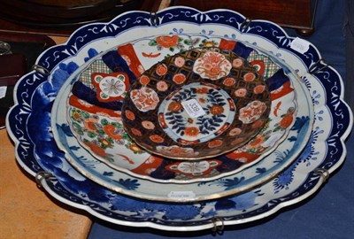 Lot 339 - Two Japanese chargers, an English Delft charger and an oval Japanese Imari dish