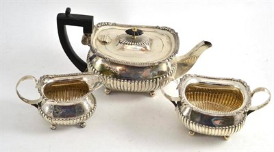 Lot 372 - Silver three piece semi-fluted tea service