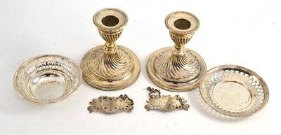 Lot 386 - Pair of loaded silver dwarf candlesticks, pair of Victorian silver bottle labels and two small...