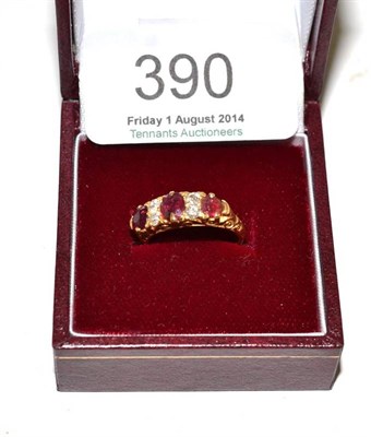 Lot 390 - An 18ct gold diamond and ruby ring