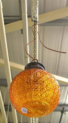 Lot 396 - A cut amber glass hanging hall lamp