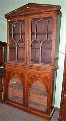 Lot 482 - A mahogany bookcase base with glazed cabinet doors and a similar upper section