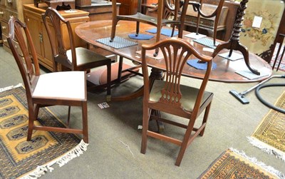 Lot 501 - Mahogany dining table, four chairs, extension leaf and table mats with table protector