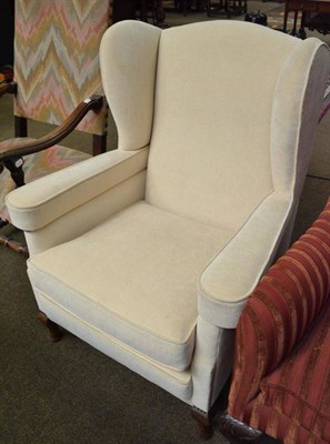 Lot 534 - Upholstered wing armchair