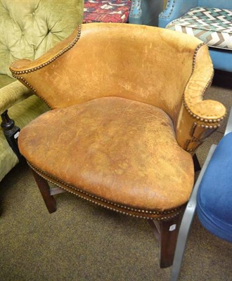 Lot 548 - A 19th century close nailed leather upholstered desk chair