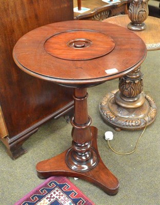 Lot 552 - A 19th century mahogany circular plant table on triform base