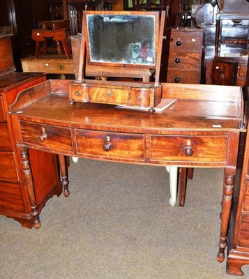 Lot 555 - George IV mahogany bow fronted dressing table and a William IV toilet mirror