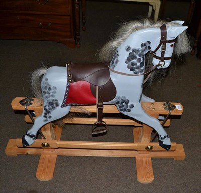 Lot 559 - Painted rocking horse on pine base