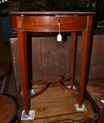 Lot 565 - An Edwardian mahogany inlaid oval occasional table with hinged top