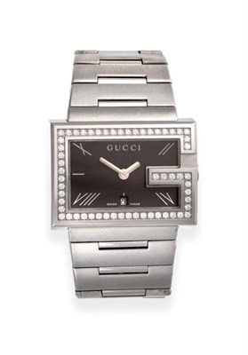 Lot 181 - A Stainless Steel Calendar Diamond Set Wristwatch, signed Gucci, model: Gucci G Rectangular...