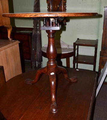 Lot 576 - George III mahogany tripod table with bird cage action