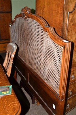 Lot 578 - An early 20th century bed with caned bed head and end