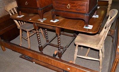 Lot 579 - An oak gateleg table and a pair of elm kitchen chairs