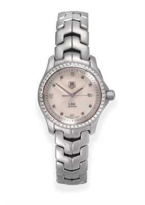 Lot 187 - A Lady's Stainless Steel Calendar Centre Seconds Wristwatch, signed Tag Heuer, model: Link, 200...