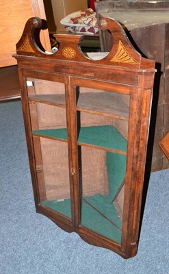 Lot 674 - A glazed mahogany corner cabinet