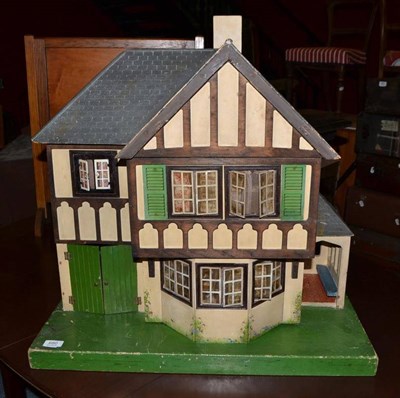 Lot 680 - A Tri-ang wooden 'Tudor' dolls house