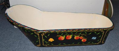 Lot 736 - A Toleware tin bath, painted with flowers and fruit on a black ground