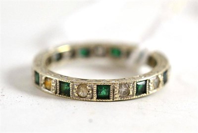 Lot 16 - Diamond and emerald eternity ring