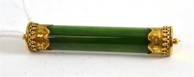 Lot 24 - Jadeite bar brooch with 15ct gold mount